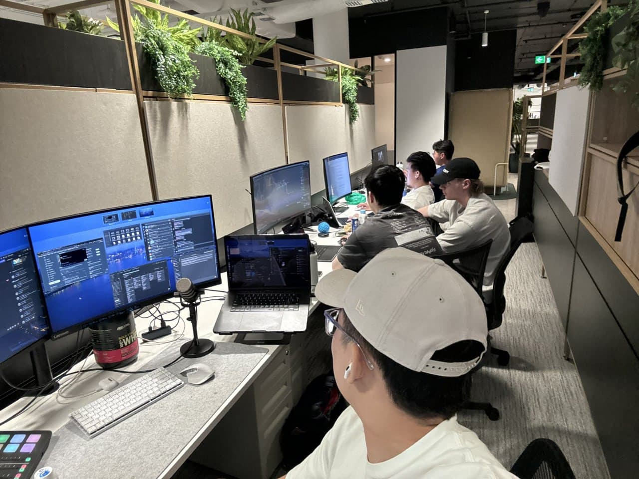 Surgence Labs team working together in a production studio