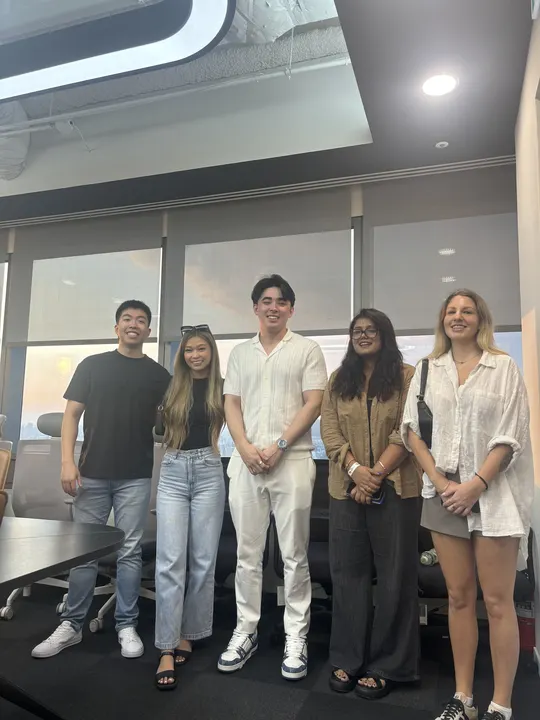 Surgence Labs team members with a visiting client team
